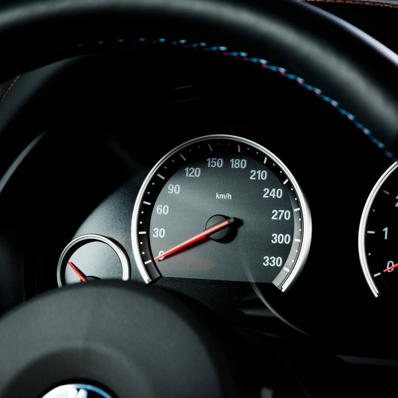 Close up shot of a speedometer in a car